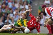 20 August 2006; Colm Cooper, Kerry, is tackled by Kieran O'Connor, Cork, as Cork goalkeeper Alan Quirke waits to pick up the loose ball. Bank of Ireland All-Ireland Senior Football Championship Semi-Final, Kerry v Cork, Croke Park, Dublin. Picture credit: Brendan Moran / SPORTSFILE