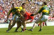 20 August 2006; Conor McCarthy, Cork, is tackled by Kerry players Tomas O Se, 5, Aidan O'Mahony and Michael McCarthy. Bank of Ireland All-Ireland Senior Football Championship Semi-Final, Kerry v Cork, Croke Park, Dublin. Picture credit: Ray McManus / SPORTSFILE