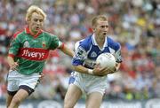 20 August 2006; Joe Higgins, Laois, in action against Conor Mortimer, Mayo. Bank of Ireland All-Ireland Senior Football Championship Quarter-Final Replay, Laois v Mayo, Croke Park, Dublin. Picture credit: Ray McManus / SPORTSFILE