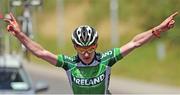 16 July 2014; Eddie Dunbar, Team Ireland, celebrates as he crosses the finishline to take victory on Stage 2 of the 2014 International Junior Tour of Ireland, Ennis - Ennis, Co. Clare. Picture credit: Stephen McMahon / SPORTSFILE