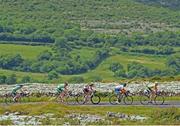 16 July 2014; Race leader Michael O'Loughlin, Team Ireland, leads a chasing group through The Burren during Stage 2 of the 2014 International Junior Tour of Ireland, Ennis - Ennis, Co. Clare. Picture credit: Stephen McMahon / SPORTSFILE