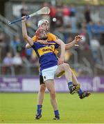 16 July 2014; Colin O'Riordan, Tipperary, in action against Conor Cleary, Clare. Bord Gais Energy Munster GAA Hurling Under 21 Championship Semi-Final, Clare v Tipperary, Cusack Park, Ennis, Co. Clare Picture credit: Diarmuid Greene / SPORTSFILE