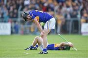 16 July 2014; Dejected Tipperary player Dan McCormack, left, and Cathal Barrett, Tipperary after the final whistle is blown. Bord Gais Energy Munster GAA Hurling Under 21 Championship Semi-Final, Clare v Tipperary, Cusack Park, Ennis, Co. Clare. Picture credit: Barry Cregg / SPORTSFILE