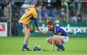 16 July 2014; Jarlath Colleran, Clare, exchanges a handshake with Jason Forde, Tipperary, after the game. Bord Gais Energy Munster GAA Hurling Under 21 Championship Semi-Final, Clare v Tipperary, Cusack Park, Ennis, Co. Clare Picture credit: Diarmuid Greene / SPORTSFILE