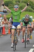 17 July 2014; Matthew Teggart, Nicolas Roche Performance Team, celebrates as he approaches the finish line to take victory on Stage 3 of the 2014 International Junior Tour of Ireland, Ennis - Ennistimon, Co. Clare. Picture credit: Stephen McMahon / SPORTSFILE