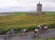 17 July 2014; A general view of the action as riders approach the summit of Castle Hill during Stage 3 of the 2014 International Junior Tour of Ireland, Ennis - Ennistimon, Co. Clare. Picture credit: Stephen McMahon / SPORTSFILE