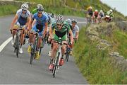 17 July 2014; Stephen Shanahan, Team Ireland, leads the peloton on the approach to the Cliffs of Moher during Stage 3 of the 2014 International Junior Tour of Ireland, Ennis - Ennistimon, Co. Clare. Picture credit: Stephen McMahon / SPORTSFILE