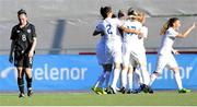 18 July 2014; England players celebrate their side's first goal as a dejected Amy O'Connor, Republic of Ireland, walks back to the half way line. UEFA Women's U19 Championship Final, Republic of Ireland v England, Mjøndalen Stadium, Mjondalen, Norway. Picture credit: Morten Olsen / SPORTSFILE