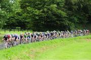 18 July 2014; Dylan O'Brien, Munster Sensa, leads the peloton on the approach to Scarriff during Stage 4 of the 2014 International Junior Tour of Ireland, Mountshannon - Whitegate, Co. Clare. Picture credit: Stephen McMahon / SPORTSFILE
