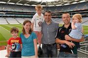 19 July 2014: Johnny Doyle, is the latest to feature on the Bord Gáis Energy Legends Tour Series 2014 when he gave a unique tour of the Croke Park stadium and facilities this week. Other greats of the game still to feature this summer on the Bord Gáis Energy Legends Tour Series include Brendan Cummins, Brian Corcoran, Maurice Fitzgerald and Mickey Whelan. Full details and dates for the Bord Gáis Energy Legends Tour Series 2014 are available on www.crokepark.ie/events. Pictured are Johnny Doyle, with the Moore family, from left to right, Ronan, age 3, Una, Ciaran, age 5, Vinnie and Roisin, age 1, from Bohernabreena, Co. Dublin. Croke Park, Dublin. Photo by Sportsfile