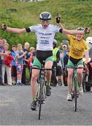 19 July 2014; Michael O'Loughlin, Team Ireland, left, celebrates as he approaches the finishline to take victory on Stage 5 of the 2014 International Junior Tour of Ireland, Ennis - Gallows Hill, Co. Clare. Picture credit: Stephen McMahon / SPORTSFILE