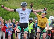 19 July 2014; Michael O'Loughlin, Team Ireland, left, celebrates as he approaches the finishline to take victory on Stage 5 of the 2014 International Junior Tour of Ireland, Ennis - Gallows Hill, Co. Clare. Picture credit: Stephen McMahon / SPORTSFILE