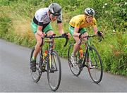 19 July 2014; Michael O'Loughlin, Team Ireland, left, leads team-mate and race leader Eddie Dunbar during Stage 5 of the 2014 International Junior Tour of Ireland, Ennis - Gallows Hill, Co. Clare. Picture credit: Stephen McMahon / SPORTSFILE