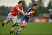 19 July 2014; Conor Daly, Roscommon, in action against Charlie Vernon, Armagh. GAA Football All Ireland Senior Championship, Round 3B, Roscommon v Armagh, Dr. Hyde Park, Roscommon. Picture credit: Barry Cregg / SPORTSFILE