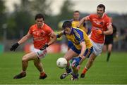 19 July 2014; Cathal Cregg, Roscommon, in action against James Morgan, left, and Brendan Donaghy, Armagh. GAA Football All Ireland Senior Championship, Round 3B, Roscommon v Armagh, Dr. Hyde Park, Roscommon. Picture credit: Barry Cregg / SPORTSFILE