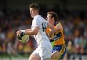 19 July 2014; Pádraig Fogarty, Kildare, in action against Kevin Hartnett, Clare. GAA Football All Ireland Senior Championship, Round 3B, Clare v Kildare, Cusack Park, Ennis, Co. Clare. Picture credit: Diarmuid Greene / SPORTSFILE