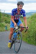 19 July 2014; Jonathan Brown, Hot Tubes Cycling, on the approach to the summit of the Category 1 climb of Gallows Hill at the finish of Stage 5 of the 2014 International Junior Tour of Ireland, Ennis - Gallows Hill, Co. Clare. Picture credit: Stephen McMahon / SPORTSFILE