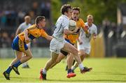 19 July 2014; Ollie Lyons, Kildare, in action against Martin McMahon, left, and Shane Brennan, Clare. GAA Football All Ireland Senior Championship, Round 3B, Clare v Kildare, Cusack Park, Ennis, Co. Clare. Picture credit: Diarmuid Greene / SPORTSFILE