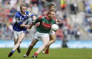 20 August 2006; David Heaney, Mayo, is tackled by Billy Sheehan, Laois. Bank of Ireland All-Ireland Senior Football Championship Quarter-Final Replay, Laois v Mayo, Croke Park, Dublin. Picture credit: Brian Lawless / SPORTSFILE