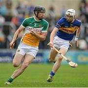 12 July 2014; Conor Mahon, Offaly, in action against Brendan Maher, Tipperary. GAA Hurling All-Ireland Senior Championship Round 2, Tipperary v Offaly, O'Moore Park, Portlaoise, Co. Laois. Picture credit: Piaras Ó Mídheach / SPORTSFILE