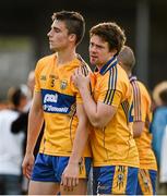 19 July 2014; Jamie Malone, left, and Stephen Collins, Clare, after defeat to Kildare. GAA Football All Ireland Senior Championship, Round 3B, Clare v Kildare, Cusack Park, Ennis, Co. Clare. Picture credit: Diarmuid Greene / SPORTSFILE