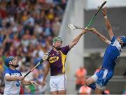 19 July 2014; Waterford goalkeeper Stephen O'Keeffe supported by his full back Liam Lawlor in action against Conor McDonald, Wexford. GAA Hurling All Ireland Senior Championship, Round 2, Waterford v Wexford, Nowlan Park, Kilkenny. Picture credit: Ray McManus / SPORTSFILE