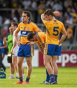 19 July 2014; Clare players, from left to right, Shane Brennan, David Tubridy and Jamie Malone, react after defeat to Kildare. GAA Football All Ireland Senior Championship, Round 3B, Clare v Kildare, Cusack Park, Ennis, Co. Clare. Picture credit: Diarmuid Greene / SPORTSFILE