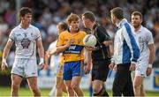 19 July 2014; Pádraic Collins, Clare, speaks to referee Joe McQuillan after the final whistle. GAA Football All Ireland Senior Championship, Round 3B, Clare v Kildare, Cusack Park, Ennis, Co. Clare. Picture credit: Diarmuid Greene / SPORTSFILE
