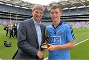 20 July 2014; Pat O'Doherty, Chief Executive Officer, ESB, proud sponsor of the Electric Ireland GAA All-Ireland Minor Championships, presents Con O'Callaghan from Dublin with the player of the match award for his outstanding performance in the Leinster GAA Football Minor Championship Final. Electric Ireland Leinster GAA Football Minor Championship Final, Kildare v Dublin, Croke Park, Dublin. Picture credit: Ray McManus / SPORTSFILE