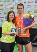 20 July 2014; Paddy Hamilton, is presented with his trophy after winning the Men's  Fingal 10K - SSE Airtricity Dublin Race Series 2014, by Jillian Saunders, SSE Airtricity. Fingal 10K - SSE Airtricity Dublin Race Series 2014. Swords, Co. Dublin. Picture credit: David Maher / SPORTSFILE