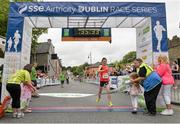 20 July 2014; Michelle McGee, crosses the finish line to win the Women's  Fingal 10K - SSE Airtricity Dublin Race Series 2014. Fingal 10K - SSE Airtricity Dublin Race Series 2014. Swords, Co. Dublin. Picture credit: David Maher / SPORTSFILE