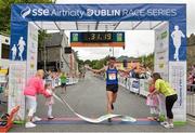 20 July 2014; Paddy Hamilton, crosses the line to win the  Men's Fingal 10K - SSE Airtricity Dublin Race Series 2014. Fingal 10K - SSE Airtricity Dublin Race Series 2014. Swords, Co. Dublin. Picture credit: David Maher / SPORTSFILE