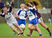 20 July 2014; Kaiesha Tobin, Waterford, scores the first goal of the game against Galway past goalkeeper Karen Connolly and defender Marie Mitchell. All-Ireland U14 'B' Ladies Football Championship Final, Galway v Waterford, MacDonagh Park, Nenagh, Co. Tipperary. Picture credit: Matt Browne / SPORTSFILE