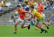 20 July 2014; Shane Conlon, Armagh, in action against Micheal Carroll, Donegal. Electric Ireland Ulster GAA Football Minor Championship Final, Armagh v Donegal, St Tiernach's Park, Clones, Co. Monaghan. Picture credit: Oliver McVeigh / SPORTSFILE