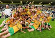 20 July 2014; The Donegal team celebrate with the cup after the game. Electric Ireland Ulster GAA Football Minor Championship Final, Armagh v Donegal, St Tiernach's Park, Clones, Co. Monaghan. Photo by Sportsfile