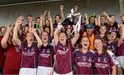 20 July 2014; Galway captain Marie Mitchell lifts the cup as her team-mates celebrate. All-Ireland U14 'B' Ladies Football Championship Final, Galway v Waterford, MacDonagh Park, Nenagh, Co. Tipperary. Picture credit: Matt Browne / SPORTSFILE