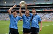 20 July 2014; Dublin players, from left, Colm Basquel, Warren Egan and Shane Clayton celebrate victory with the cup after the game. Electric Ireland Leinster GAA Football Minor Championship Final, Kildare v Dublin, Croke Park, Dublin. Picture credit: Barry Cregg / SPORTSFILE
