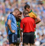 20 July 2014; Eoghan O'Gara, left, Dublin, Michael Burke, centre, Meath, and Meath goalkeeper Patrick O'Rourke in conversation with referee Padraig O'Rourke before they were all shown the yellow card. Leinster GAA Football Senior Championship Final, Dublin v Meath, Croke Park, Dublin. Picture credit: Piaras Ó Mídheach / SPORTSFILE