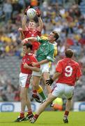 27 August 2006; Mark Brennan, Louth, fields the ball ahead of team-mates Martin Farrelly, Paddy Keenan, 9, and Leitrim's Shane Foley. Tommy Murphy Cup Final, Louth v Leitrim, Croke Park, Dublin. Picture credit; Brian Lawless / SPORTSFILE
