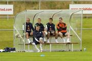 30 August 2006; Republic of Ireland players, from left, Stephen Carr, Shay Given, Damien  Duff, Liam Miller and Stephen Elliott who all sat out the second half of squad trainingm, sit on a bench watching their team-mates. Malahide FC, Malahide, Dublin. Picture credit: Pat Murphy / SPORTSFILE