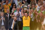 20 July 2014; Donegal captain Michael Murphy lifts the Anglo Celt cup after the game. Ulster GAA Football Senior Championship Final, Donegal v Monaghan, St Tiernach's Park, Clones, Co. Monaghan. Photo by Sportsfile