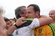 20 July 2014; Donegal manager Jim McGuinness embraces Michael Murphy after the game. Ulster GAA Football Senior Championship Final, Donegal v Monaghan, St Tiernach's Park, Clones, Co. Monaghan. Picture credit: Oliver McVeigh / SPORTSFILE