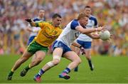 20 July 2014; Kieran Hughes, Monaghan, in action against Paddy McGrath, Donegal. Ulster GAA Football Senior Championship Final, Donegal v Monaghan, St Tiernach's Park, Clones, Co. Monaghan. Picture credit: Oliver McVeigh / SPORTSFILE