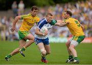 20 July 2014; Kieran Hughes, Monaghan, in action against Eamonn McGee and Anthony Thompson, Donegal. Ulster GAA Football Senior Championship Final, Donegal v Monaghan, St Tiernach's Park, Clones, Co. Monaghan. Picture credit: Oliver McVeigh / SPORTSFILE