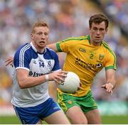 20 July 2014; Kieran Hughes, Monaghan, in action against Eamonn McGee, Donegal. Ulster GAA Football Senior Championship Final, Donegal v Monaghan, St Tiernach's Park, Clones, Co. Monaghan. Picture credit: Oliver McVeigh / SPORTSFILE