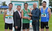 20 July 2014; Jim Dowdall, CEO, GloHealth, right, presents the gold medal for the Men's 400m Hurdles to Thomas Barr, Ferrybank AC, Waterford, in the company of silver medallist Paul Byrne, left, St Abban's AC, Laois, bronze medallist Gerard O'Donnell, Carrick-on-Shannon, Leitrim, and Ciarán Ó Catháin, President, Athletics Ireland. GloHealth Senior Track and Field Championships, Morton Stadium, Santry, Co. Dublin. Picture credit: Brendan Moran / SPORTSFILE