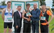 20 July 2014; Jim Dowdall, CEO, GloHealth, right, presents the gold medal for the Men's Pole Vault to Ian Rogers, Clonliffe Harriers AC, Dublin, in the company of silver medallist Thomas Houlihan, left, West Waterford AC, bronze medallist David Donegan, Clonliffe Harriers AC, Dublin and Ciarán Ó Catháin, President, Athletics Ireland. GloHealth Senior Track and Field Championships, Morton Stadium, Santry, Co. Dublin. Picture credit: Brendan Moran / SPORTSFILE