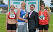20 July 2014; Ciarán Ó Catháin, President, Athletics Ireland, presents the gold medal for the Women's Shot Put to Clare Fitzgerald, Tralee Harriers AC, Kerry, in the company of silver medallist Fiona Moloney, left, Dooneen AC, Limerick, and bronze medallist Geraldine Stewart, Tir Chonaill AC, Donegal. GloHealth Senior Track and Field Championships, Morton Stadium, Santry, Co. Dublin. Picture credit: Brendan Moran / SPORTSFILE