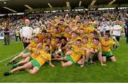 20 July 2014; Donegal players and management celebrate with the Fr Murray Cup. Electric Ireland Ulster GAA Football Minor Championship Final, Armagh v Donegal, St Tiernach's Park, Clones, Co. Monaghan. Picture credit: Oliver McVeigh / SPORTSFILE