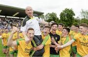 20 July 2014; Declan Molloy, Donegal manager, carried shoulder high by his players after the game. Electric Ireland Ulster GAA Football Minor Championship Final, Armagh v Donegal, St Tiernach's Park, Clones, Co. Monaghan. Picture credit: Oliver McVeigh / SPORTSFILE